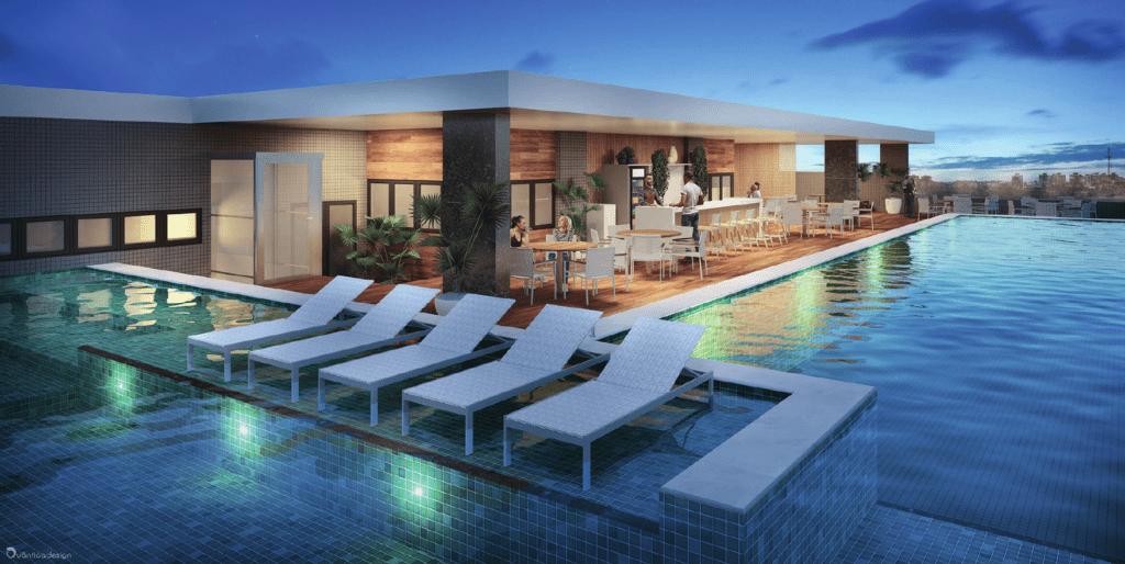 Área da piscina do rooftop ao entardecer